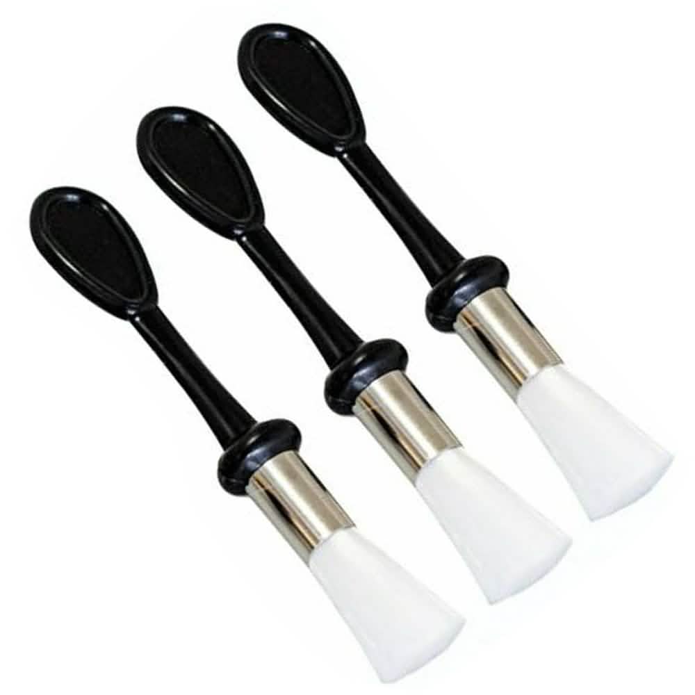 THREE cleaning brushes with black handles and white bristle ends on a white background