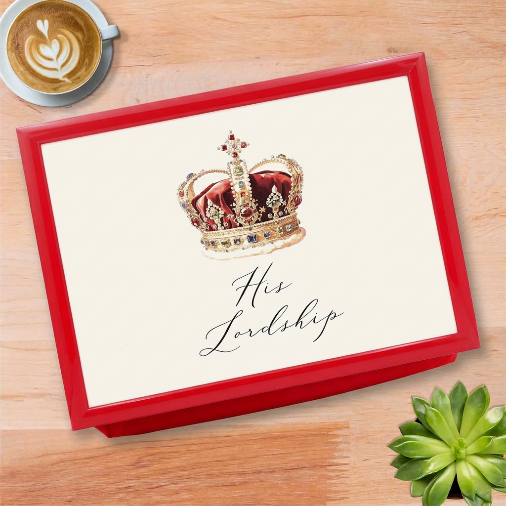 His Lordship red-framed lap tray on an oak tabletop beside coffee and a plant