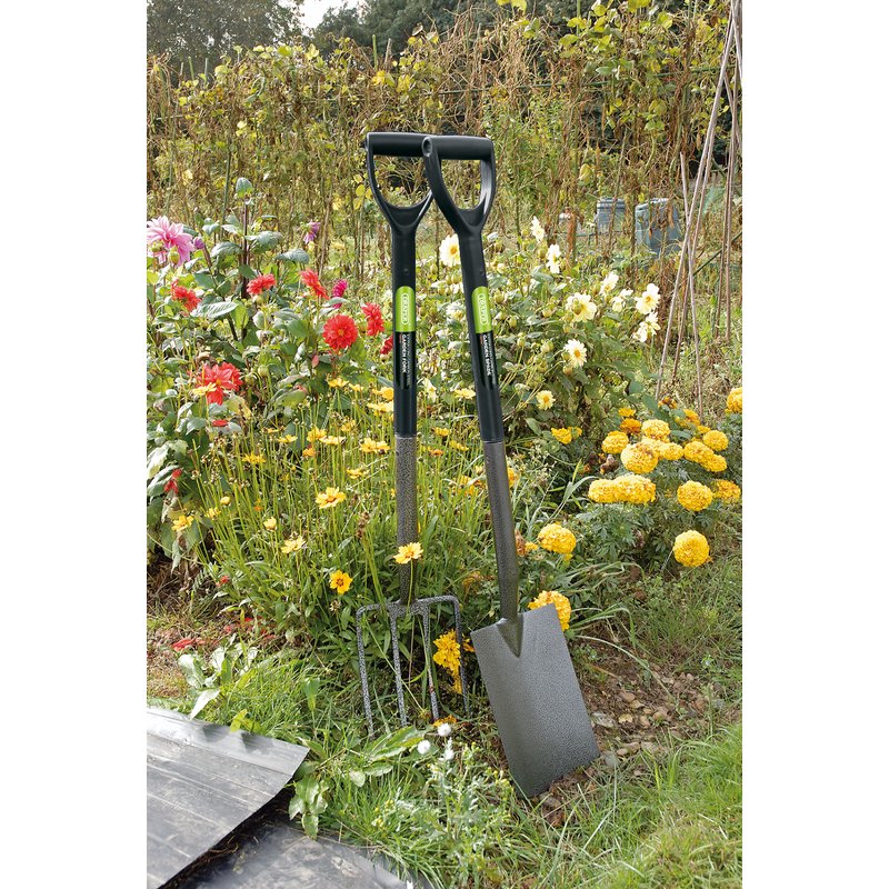 Draper - 88793 88794 - Two garden shovels leaning against a garden with flowers and plants.