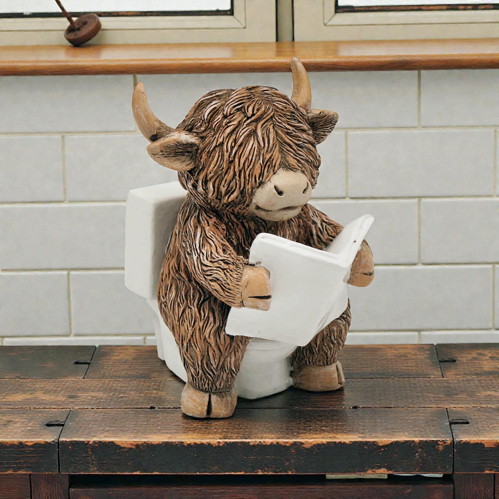 Happy Highland Cow Reading a Newspaper on the Loo Figurine | Bathroom or Toilet Ornament