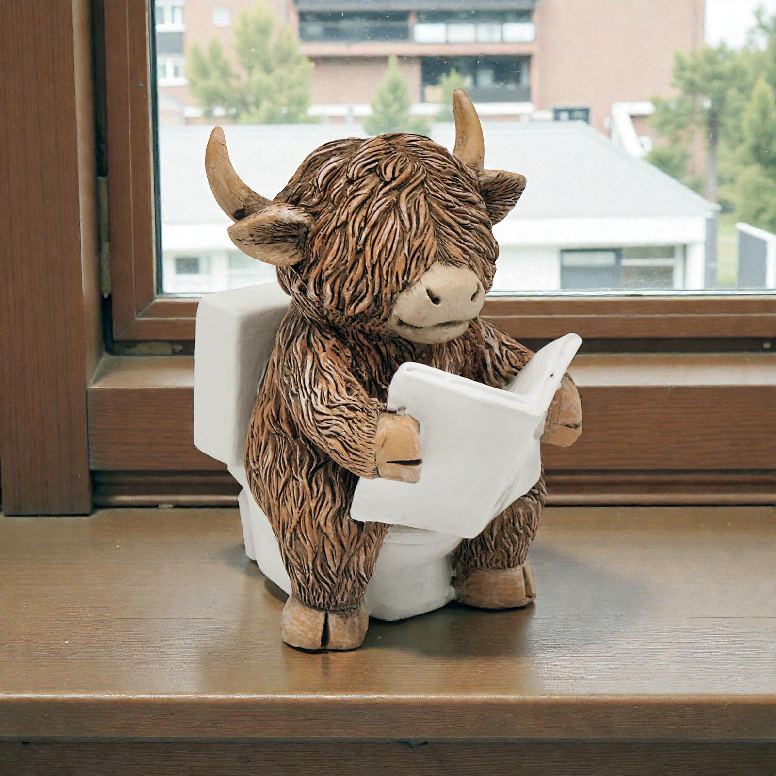 Happy Highland Cow Reading a Newspaper on the Loo Figurine | Bathroom or Toilet Ornament