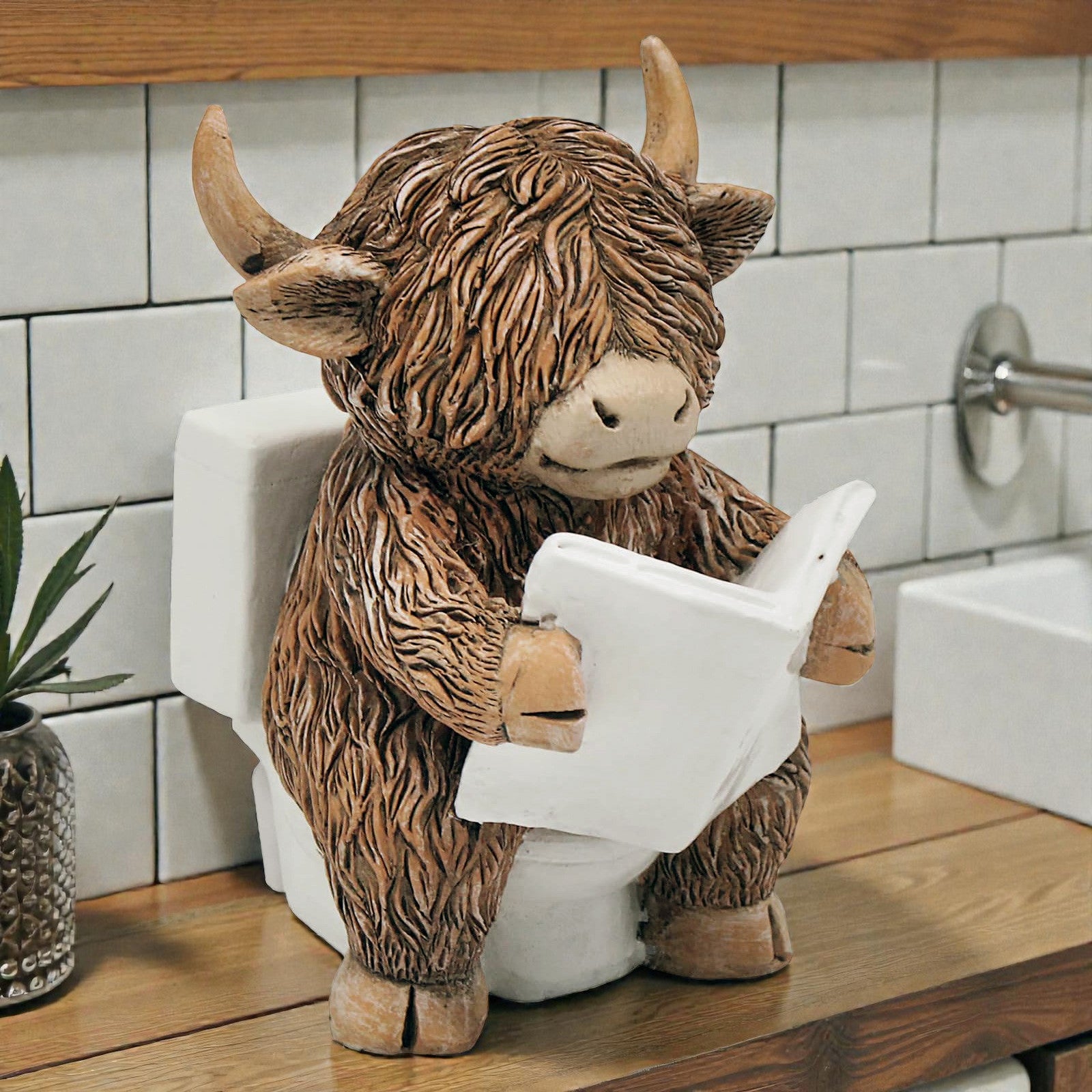 Happy Highland Cow Reading a Newspaper on the Loo Figurine | Bathroom or Toilet Ornament